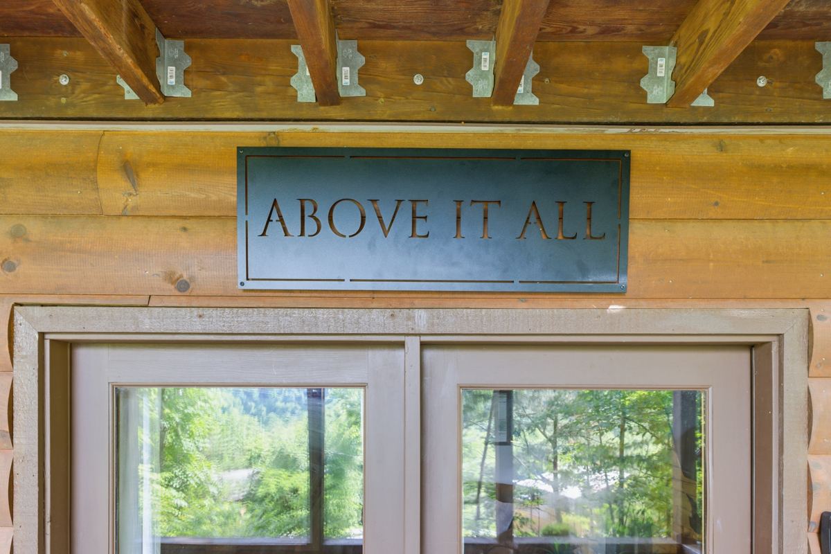 The Above It All sign over the cabin's glass doors